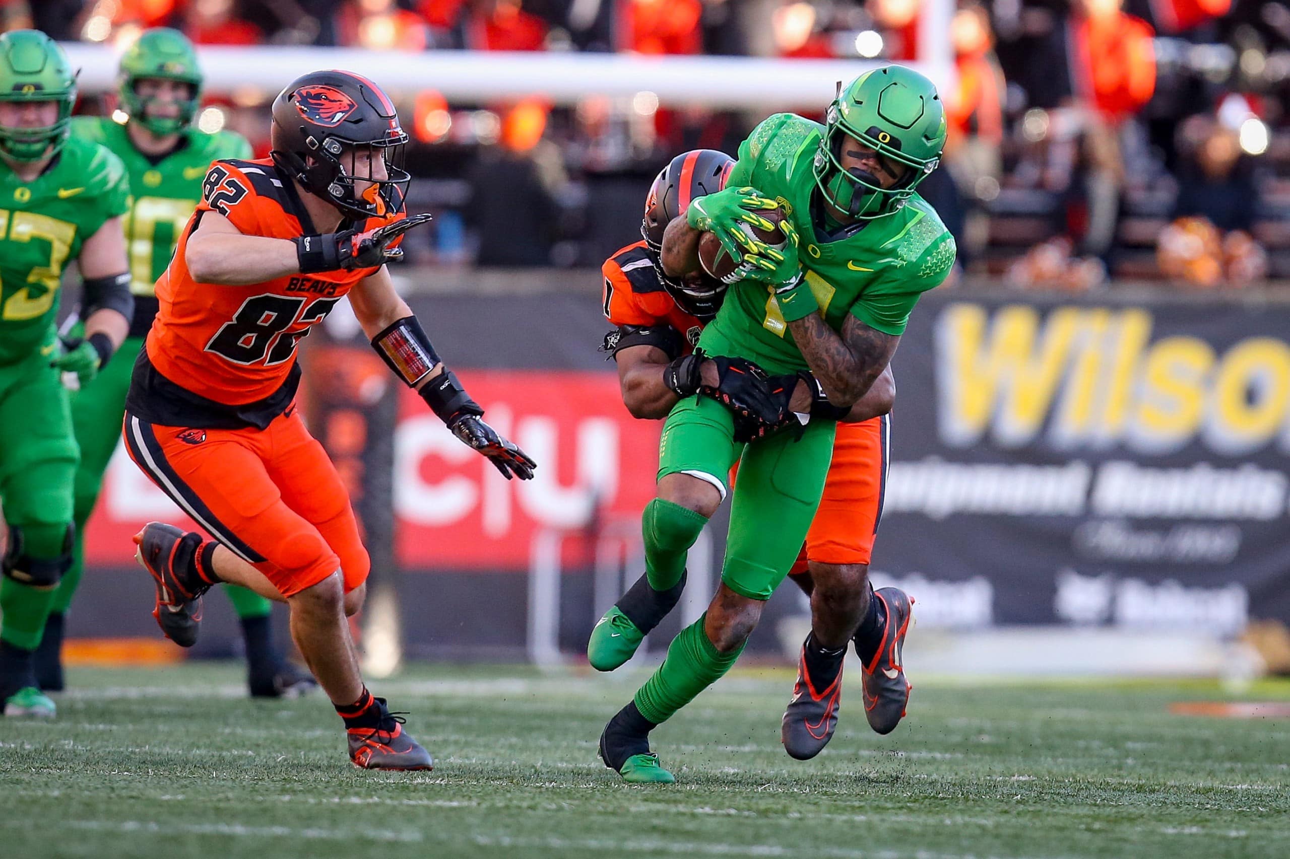 Oregon player is tackled by Oregon State player
