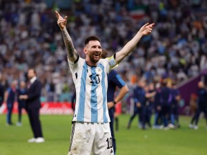 Lionel Messi celebrates after winning the World Cup with Argentina