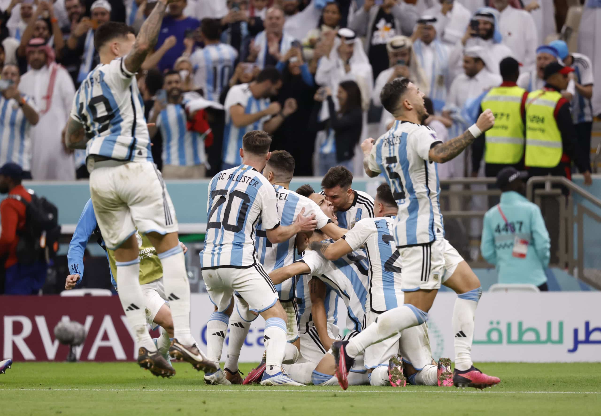 Argentina players celebrate after scoring and advancing in the World Cup knockout round