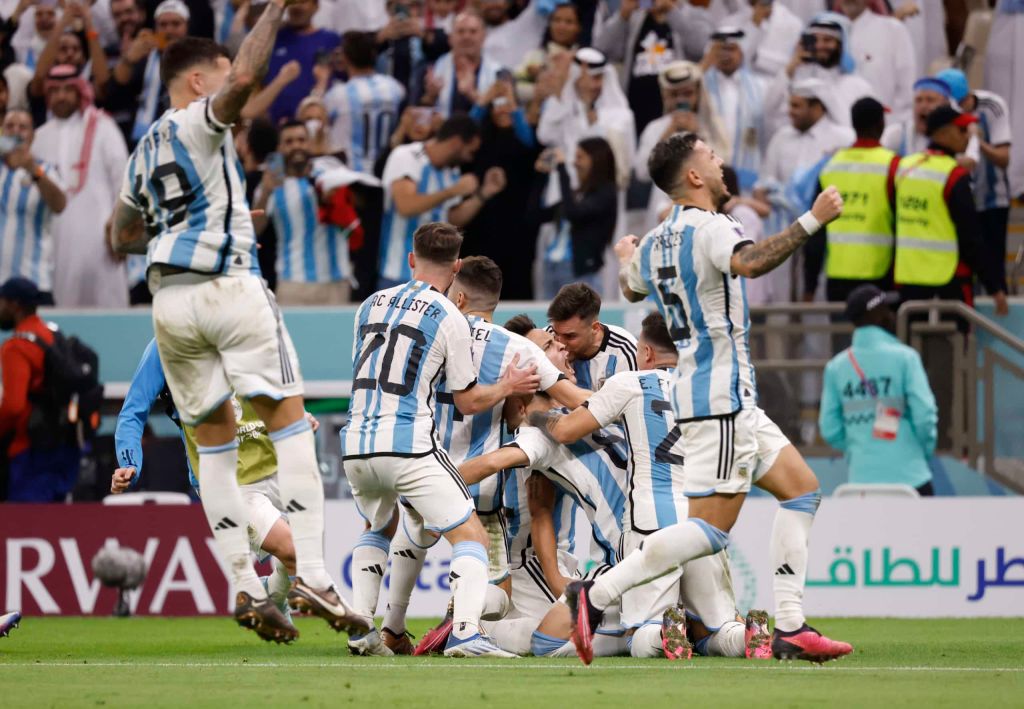 Argentina players celebrate after scoring and advancing in the World Cup knockout round