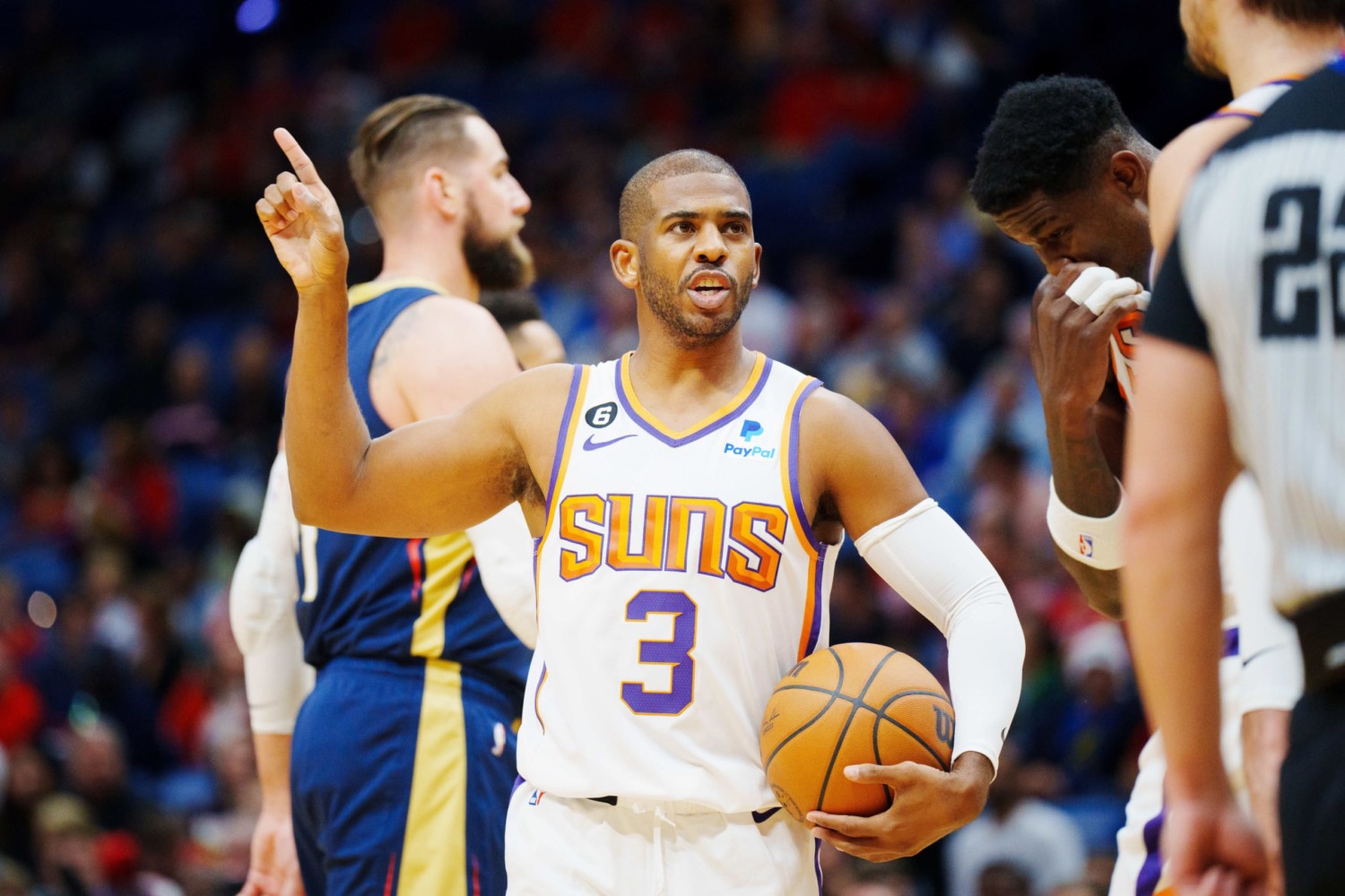 Phoenix Suns point guard Chris Paul holds ball and argues with referee