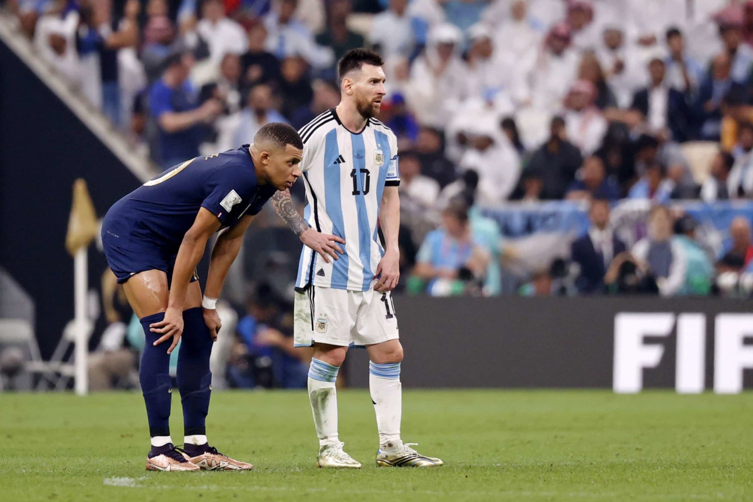 Lionel Messi and Kylian Mbappe stand side by side during World Cup final