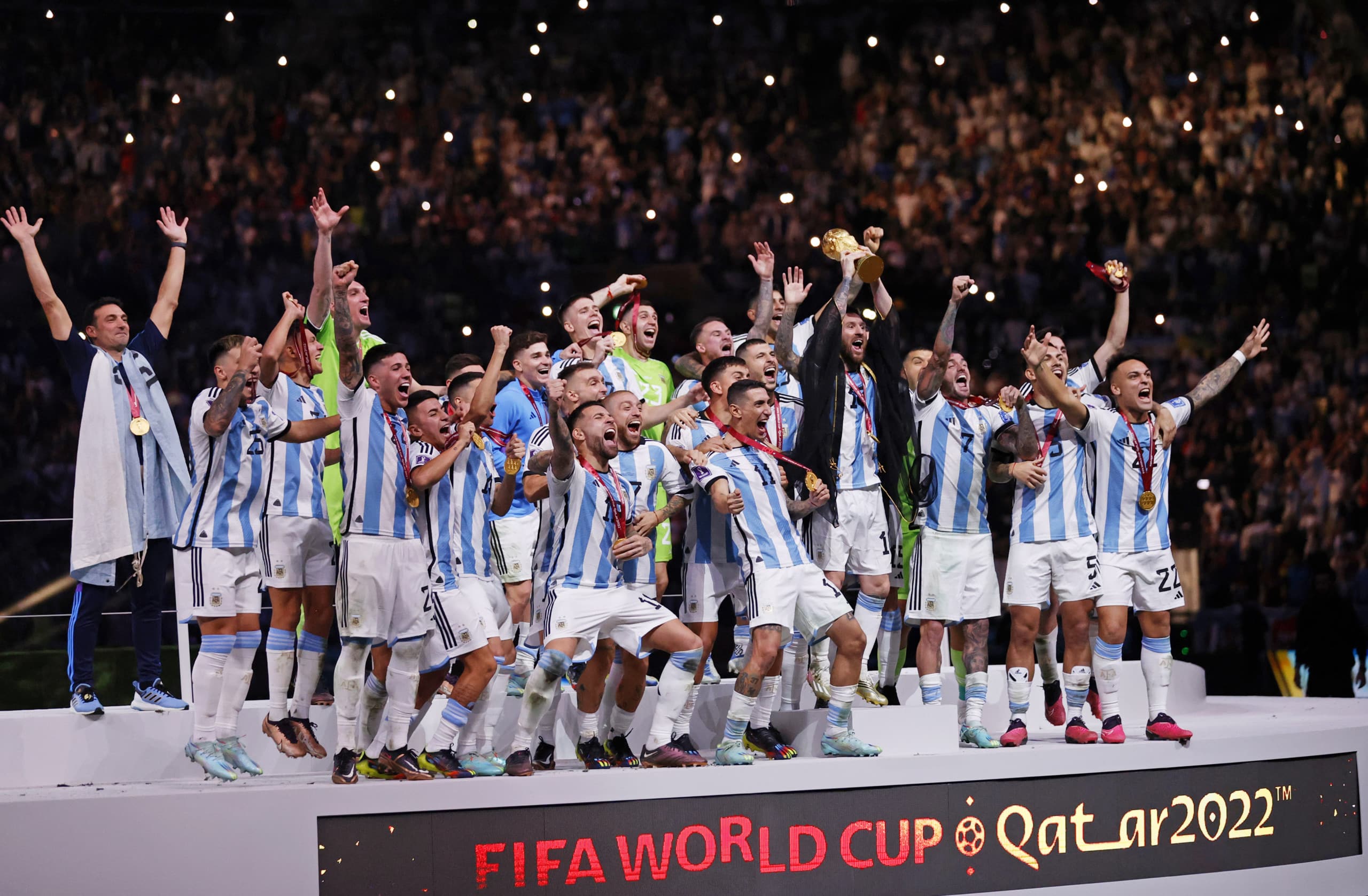 Lionel Messi and teammates lift World Cup trophy during post game ceremony