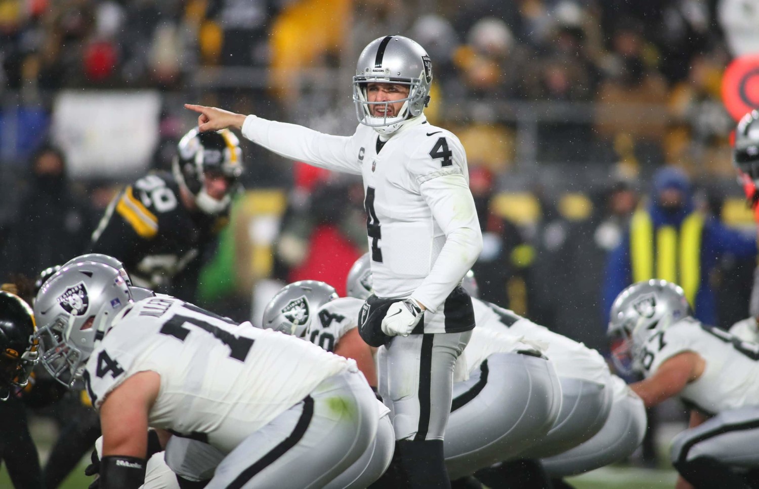 Las Vegas Raider's quarterback Derek Carr signals play against Pittsburg Steelers