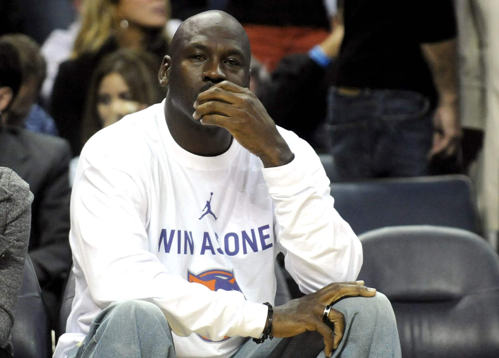 Michael Jordan sitting court side of NBA game