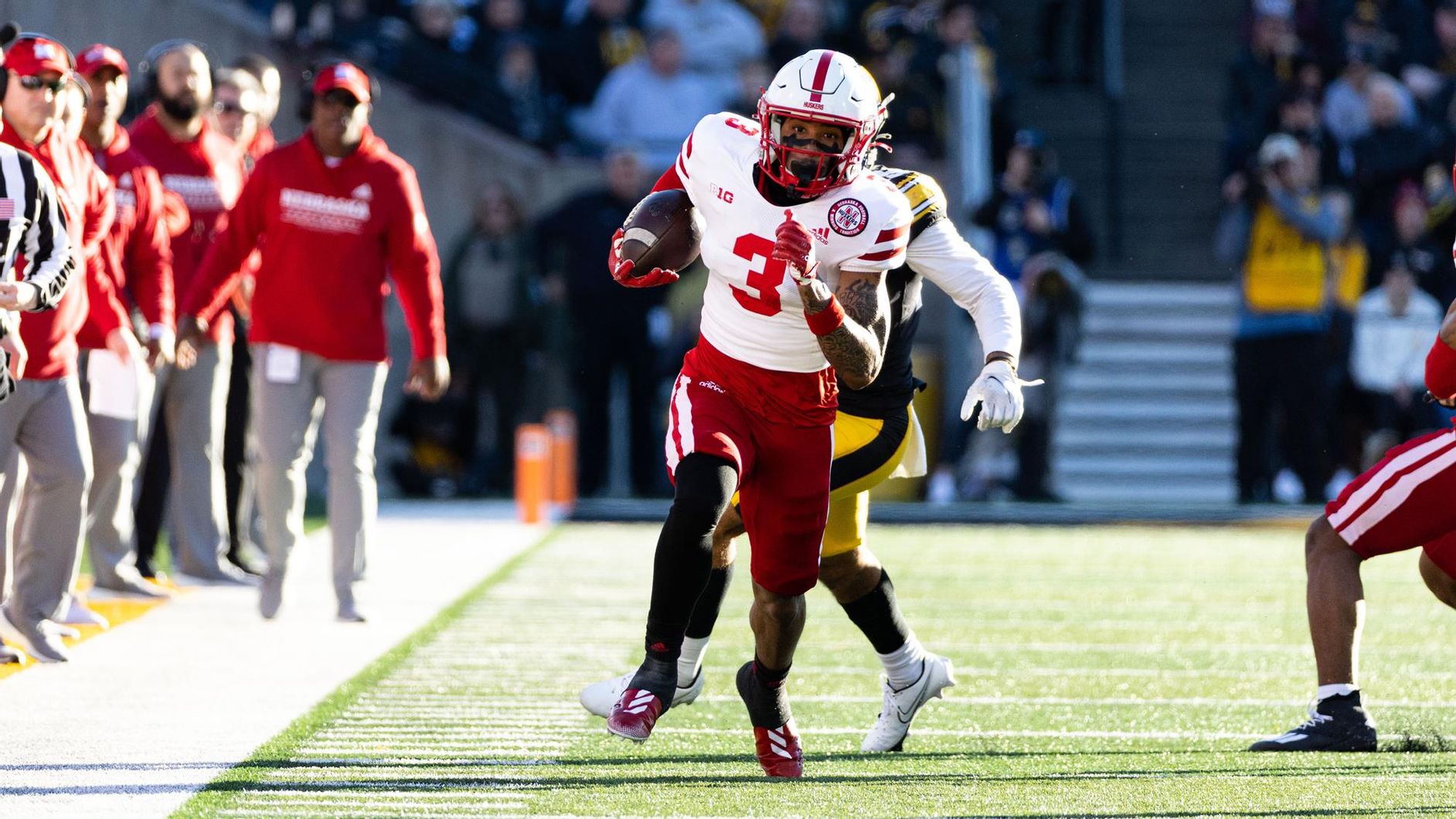 Nebraska wide receiver Trey Palmer runs past Iowa defenders