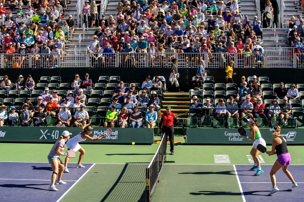 Players face off in a pickleball match.