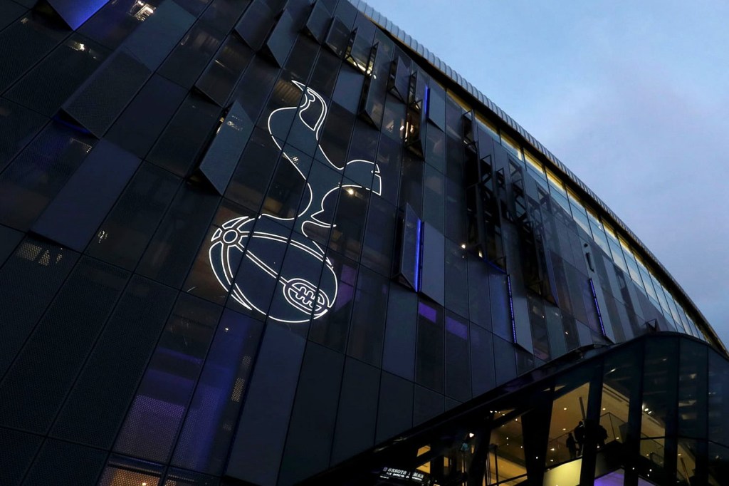 A view of the Spurs club badge on the exterior of Tottenham Hotspur Stadium in London.