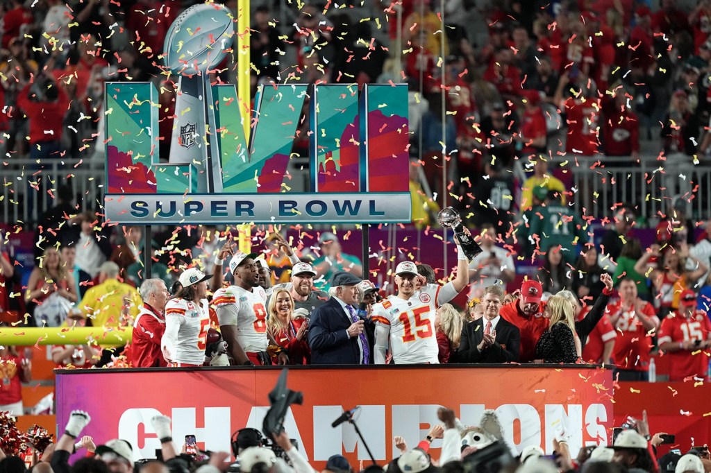 Patrick Mahomes celebrates with Kansas City Chiefs CEO Clark Hunt after winning Super Bowl LVII.