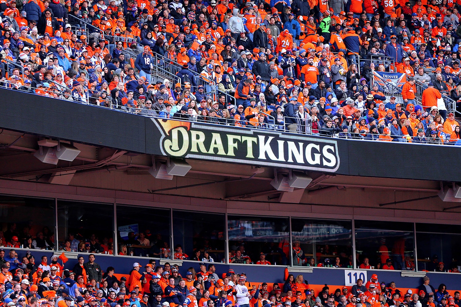 Digital signage of for Draft Kings shown inside an NFL stadium.