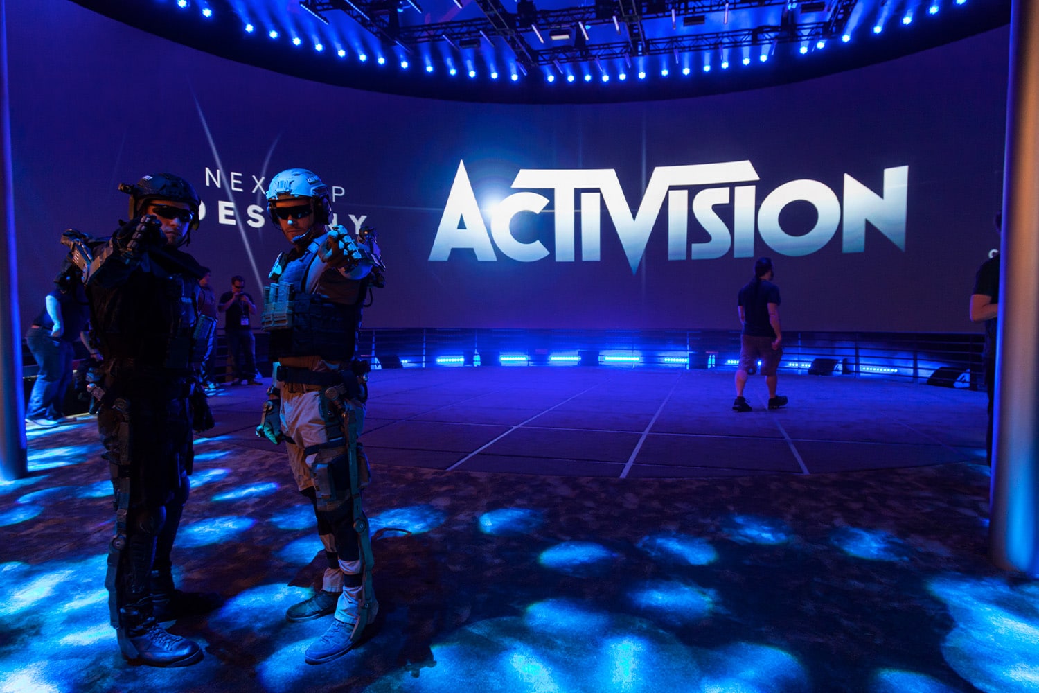 Two Call of Duty cosplayers in front of an Activision sign