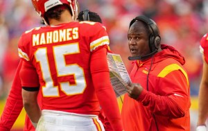 Eric Bieniemy sends instructions to Patrick Mahomes.