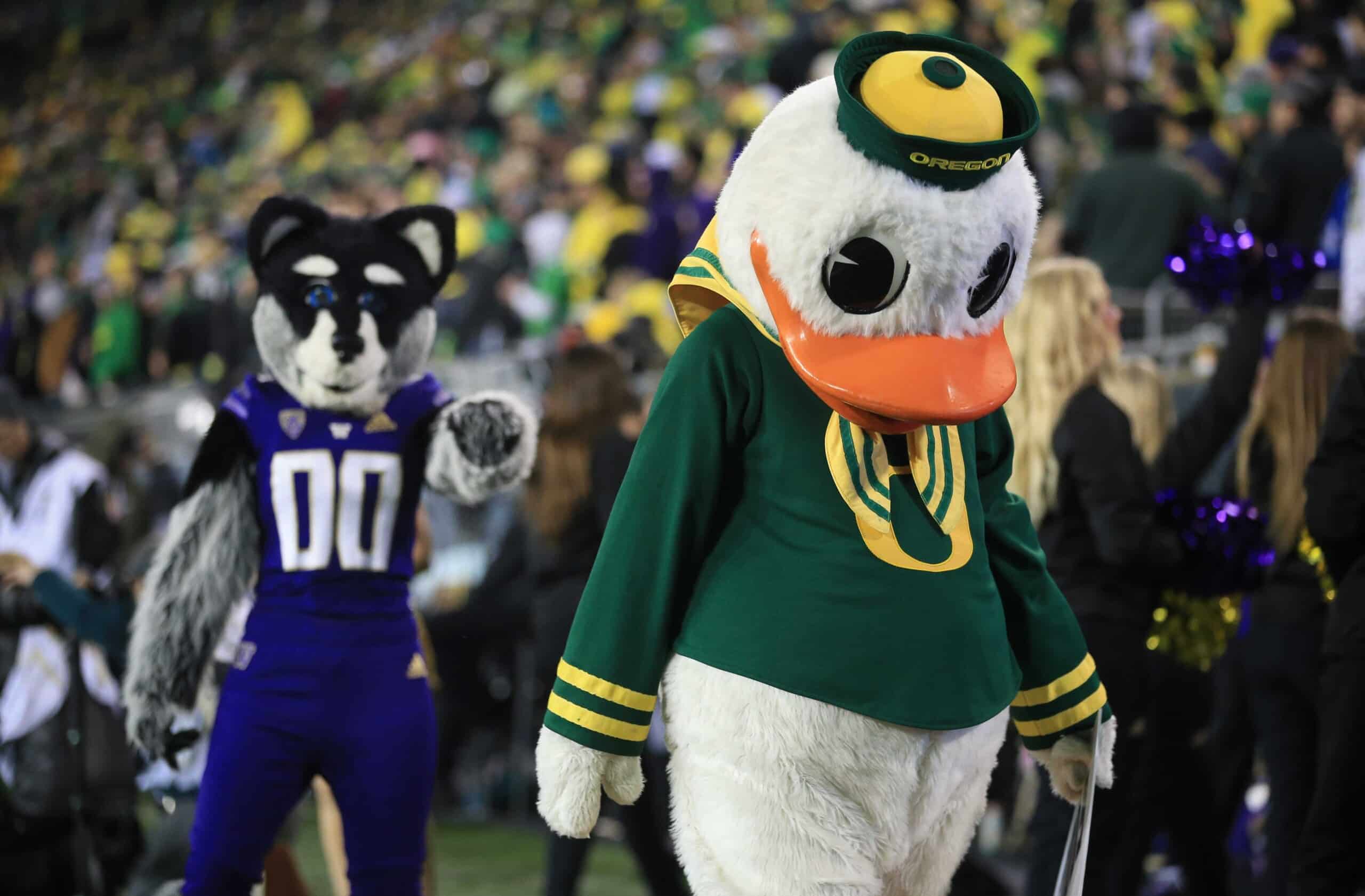 The Oregon Duck walks away from the Washington Husky mascot during the game Saturday, Nov. 12, 2022, at Autzen Stadium in Eugene, Ore.