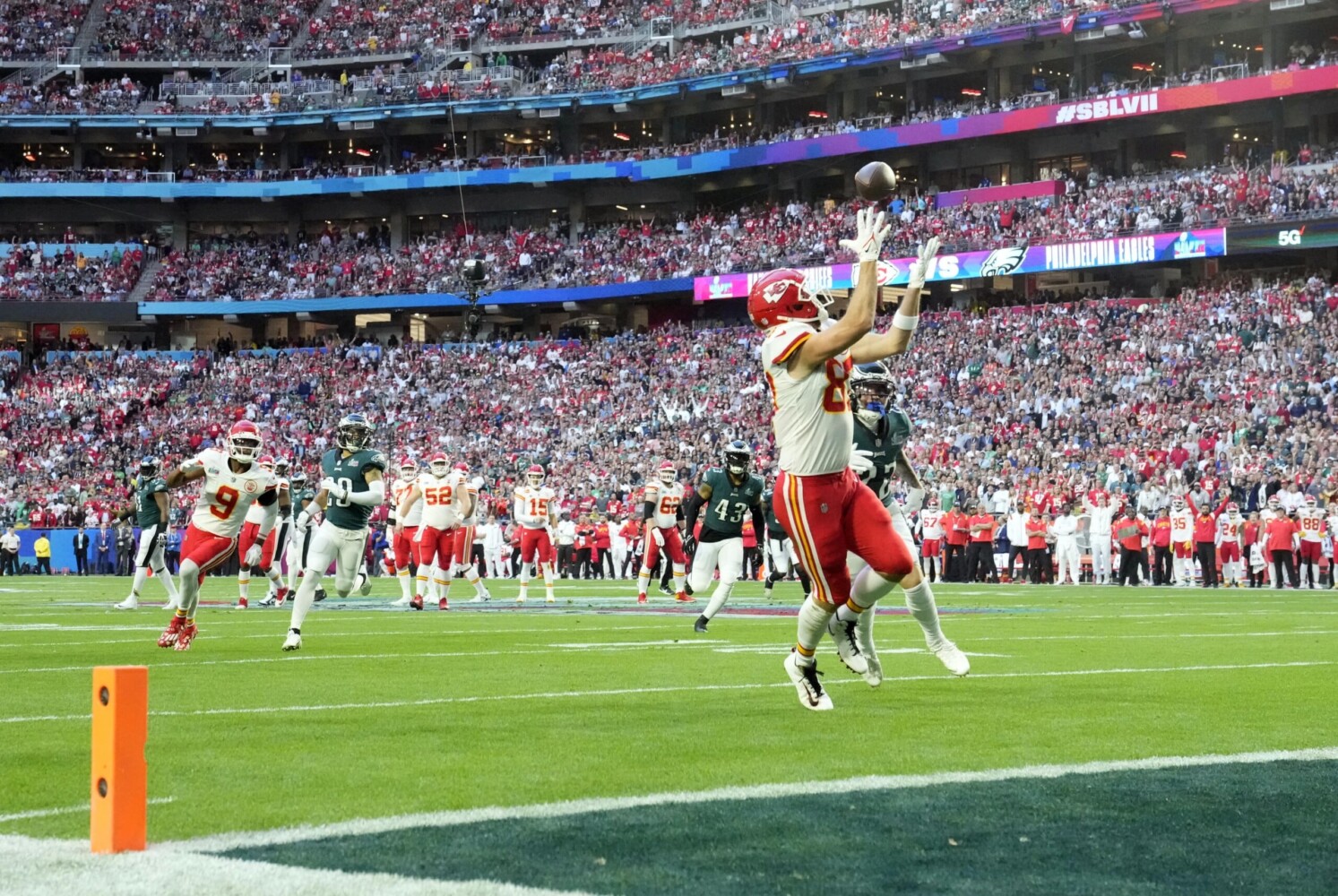 Kansas City Chiefs tight end Travis Kelce scores a touchdown against the Philadelphia Eagles during the first quarter in Super Bowl LVII.