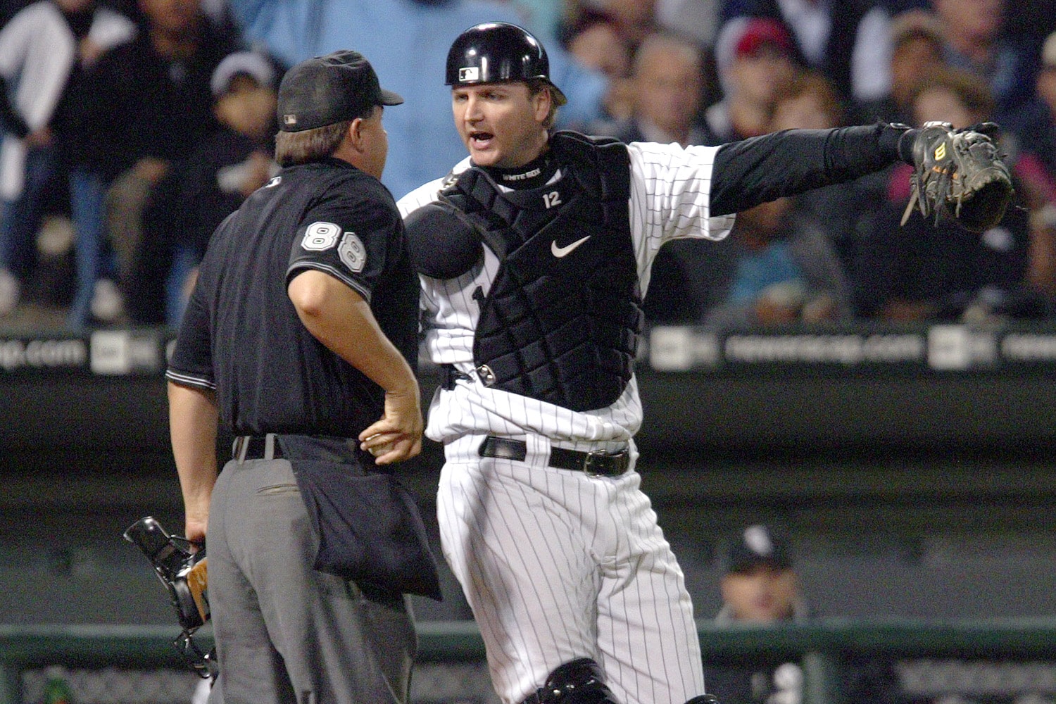 Former Chicago White Sox catcher AJ Pierzynski talks with an MLB umpire