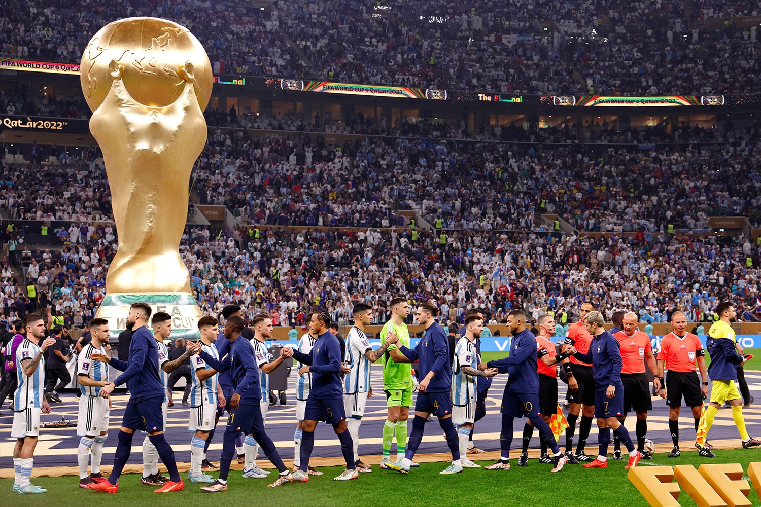 Players from Argentina and France before the World Cup Final match in December.