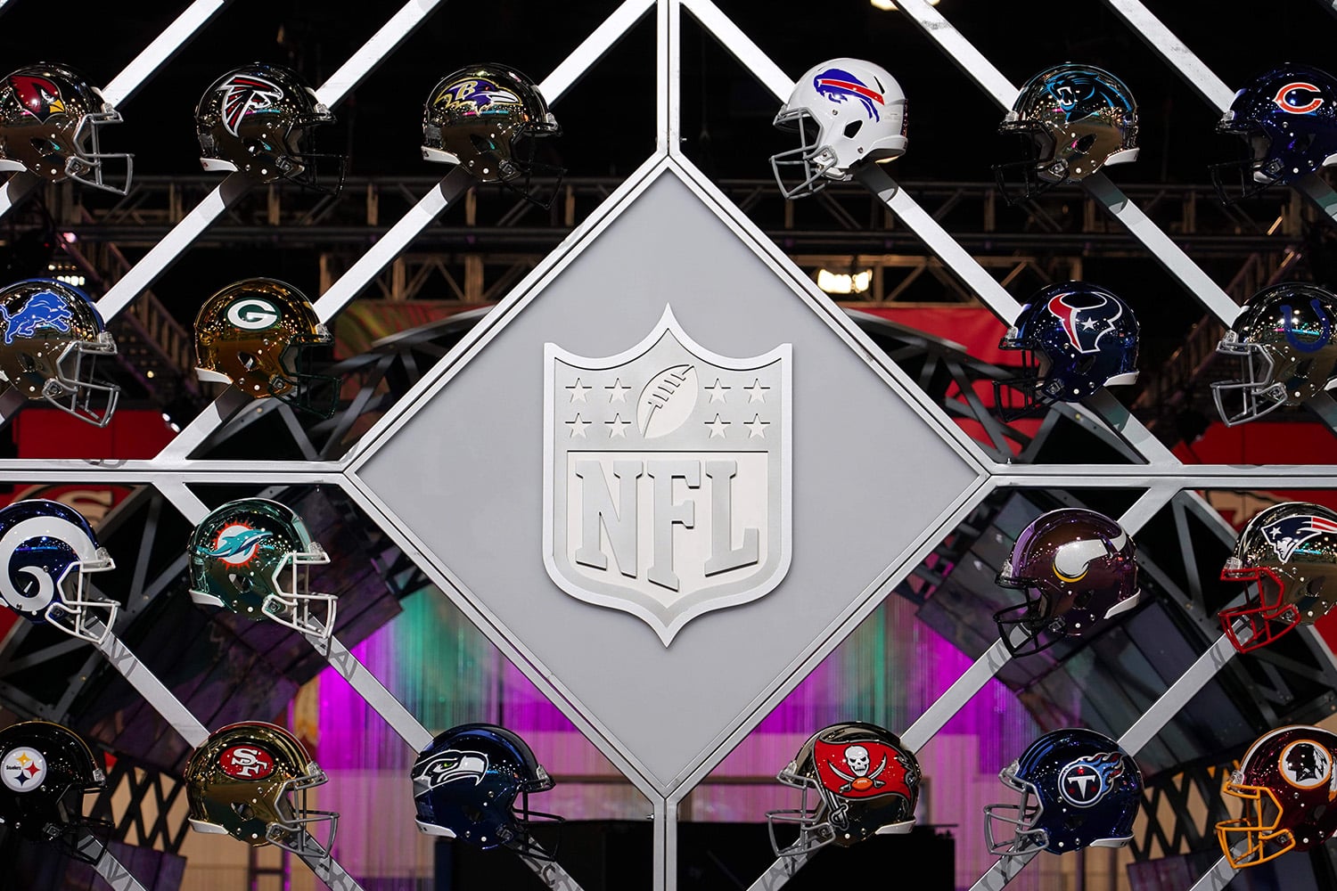 A view of the NFL logo and team helmets