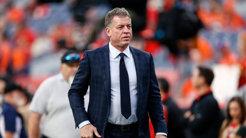 Broadcaster Troy Aikman on the sideline of an NFL game.