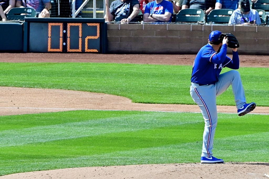Texas Rangers pitcher Dominic Leone (45) starts his windup with two seconds left on the new MLB pitch clock
