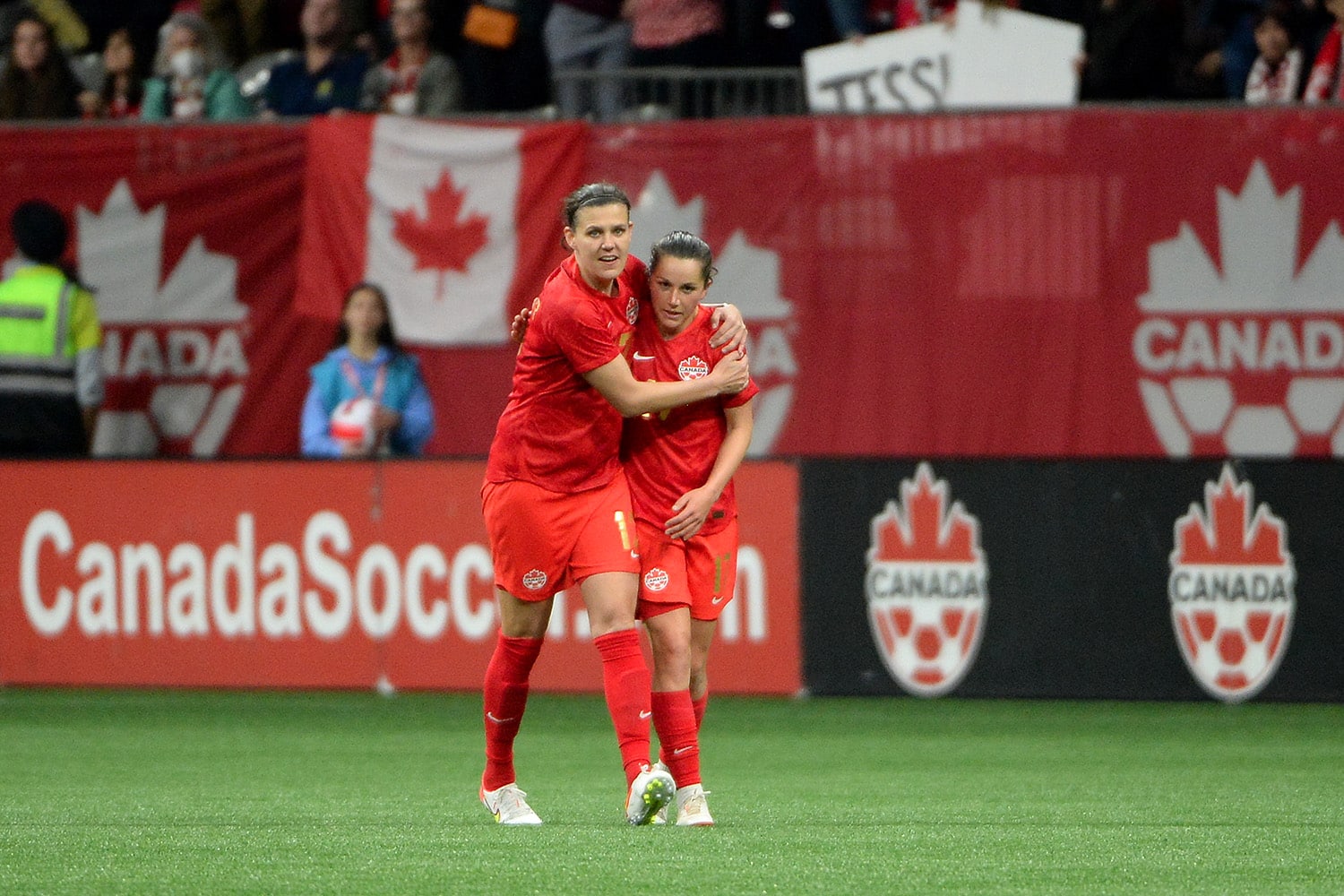 Canadian National midfielder Jessie Fleming celebrates her goal with forward Christine Sinclair.