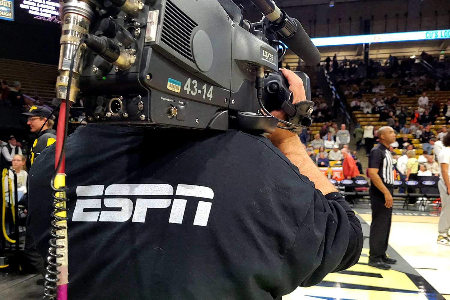 ESPN camera operator at a basketball game.