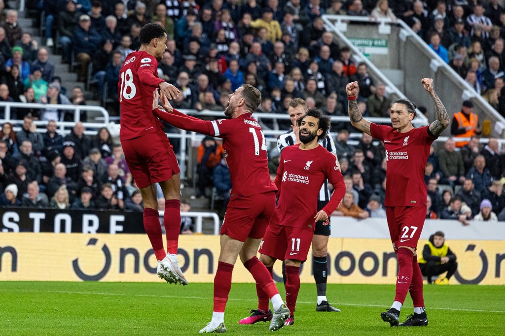 Liverpool players celebrate after a goal.