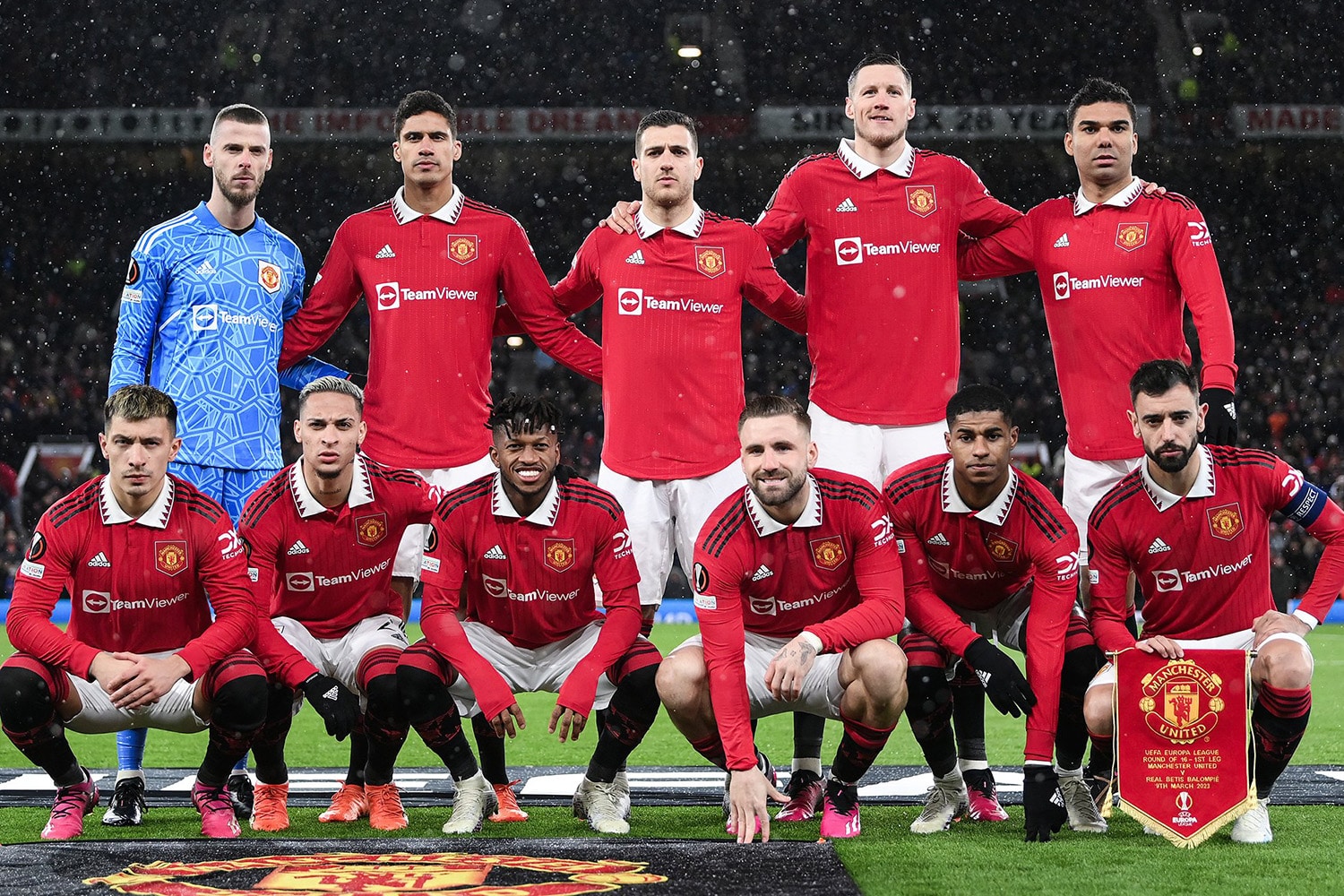 Manchester United players pose together before a home match at Old Trafford stadium.