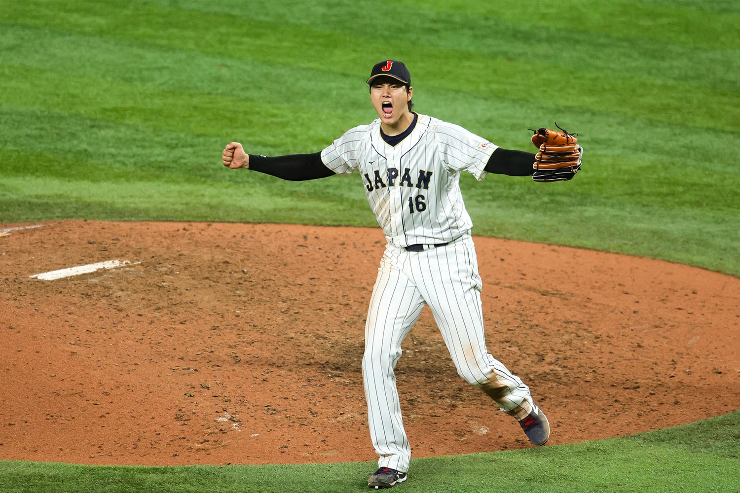 Japan pitcher Shohei Ohtani celebrates after defeating the USA in the World Baseball Classic