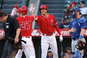 Los Angeles Angels pitcher Shohei Ohtani celebrates with teammates.