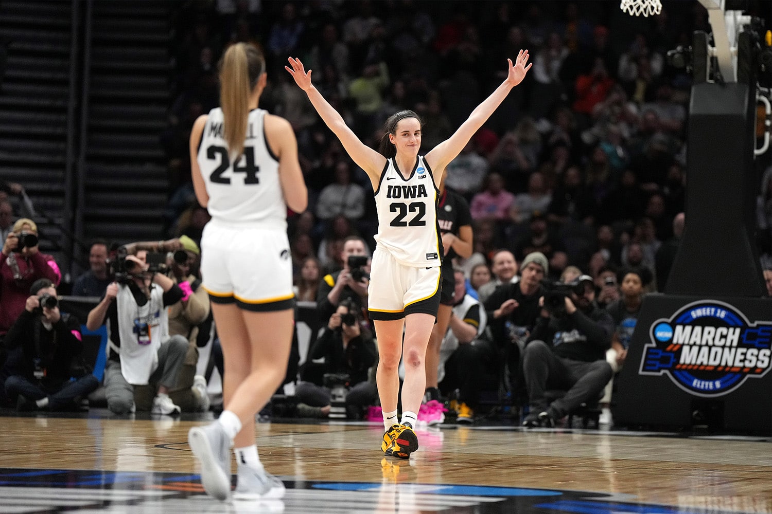 University of Iowa guard, Caitlin Clark, celebrates heading into the NCAA Women's National Championship Final Four.