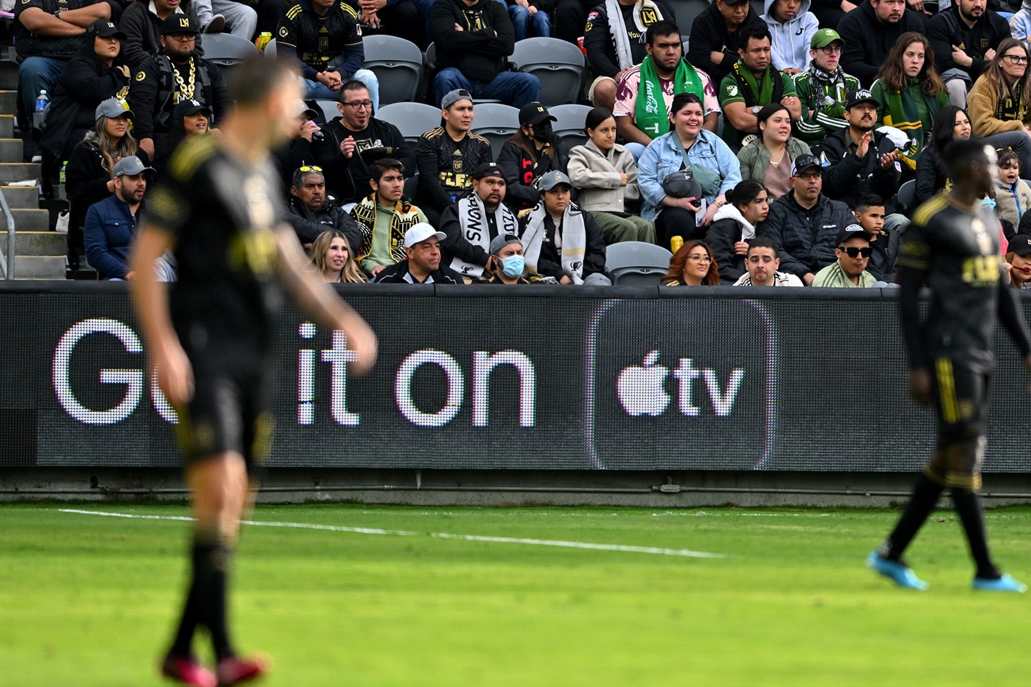 Apple TV signage on the sidelines of an MLS match.