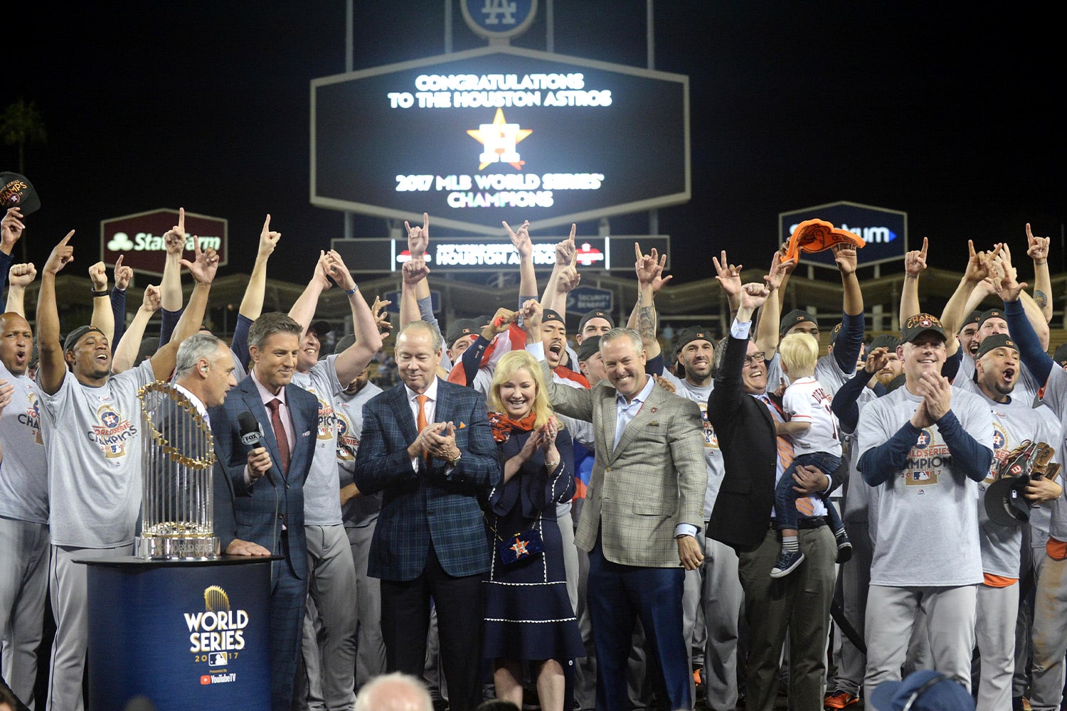 Members of the Houston Astros are presented with the Commissioner's Trophy after defeating the Los Angeles Dodgers in game seven of the 2017 World Series at Dodger Stadium