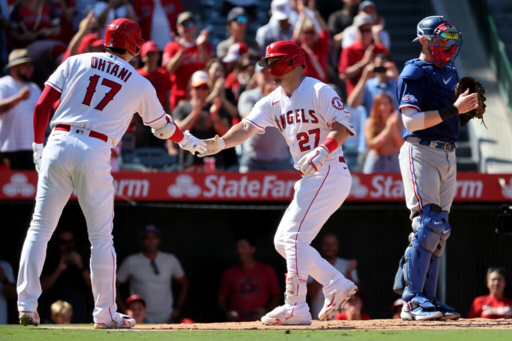 Los Angeles Angels center fielder Mike Trout (27) greeted by designated hitter Shohei Ohtani (17) after hitting a home run during the fourth inning against the Texas Rangers at Angel Stadium.