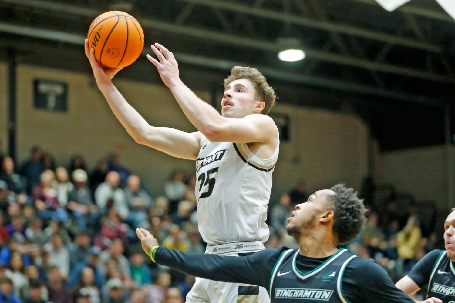 Doug Edert playing basketball for Bryant