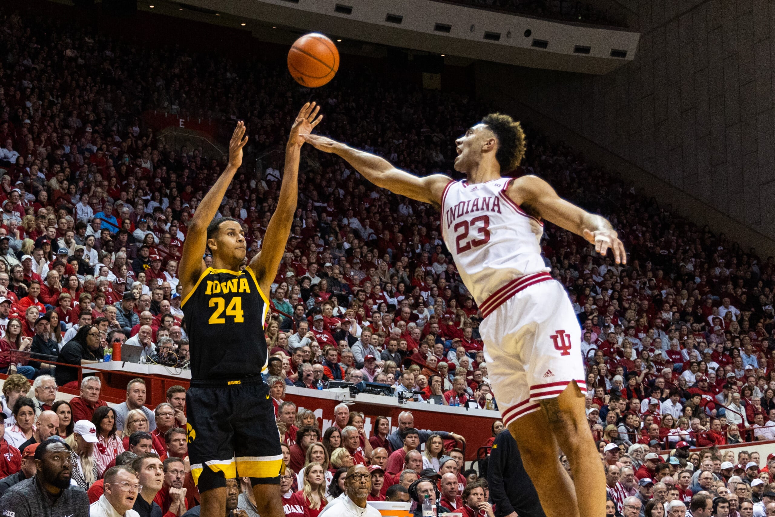 Feb 28, 2023; Bloomington, Indiana, USA; Iowa Hawkeyes forward Kris Murray (24) shoots the ball while Indiana Hoosiers forward Trayce Jackson-Davis (23) defends in the second half at Simon Skjodt Assembly Hall.