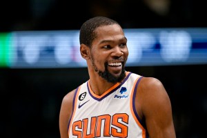 Kevin Durant smiles during a Phoenix Suns away game.