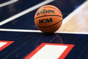 A detailed view of a basketball on the court during the CAA men's basketball tournament.