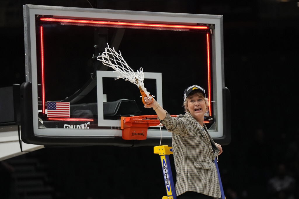 Mar 26, 2023; Seattle, WA, USA; Iowa Hawkeyes head coach Lisa Bluder reacts after cutting down the net after the game against the Louisville Cardinals at Climate Pledge Arena.