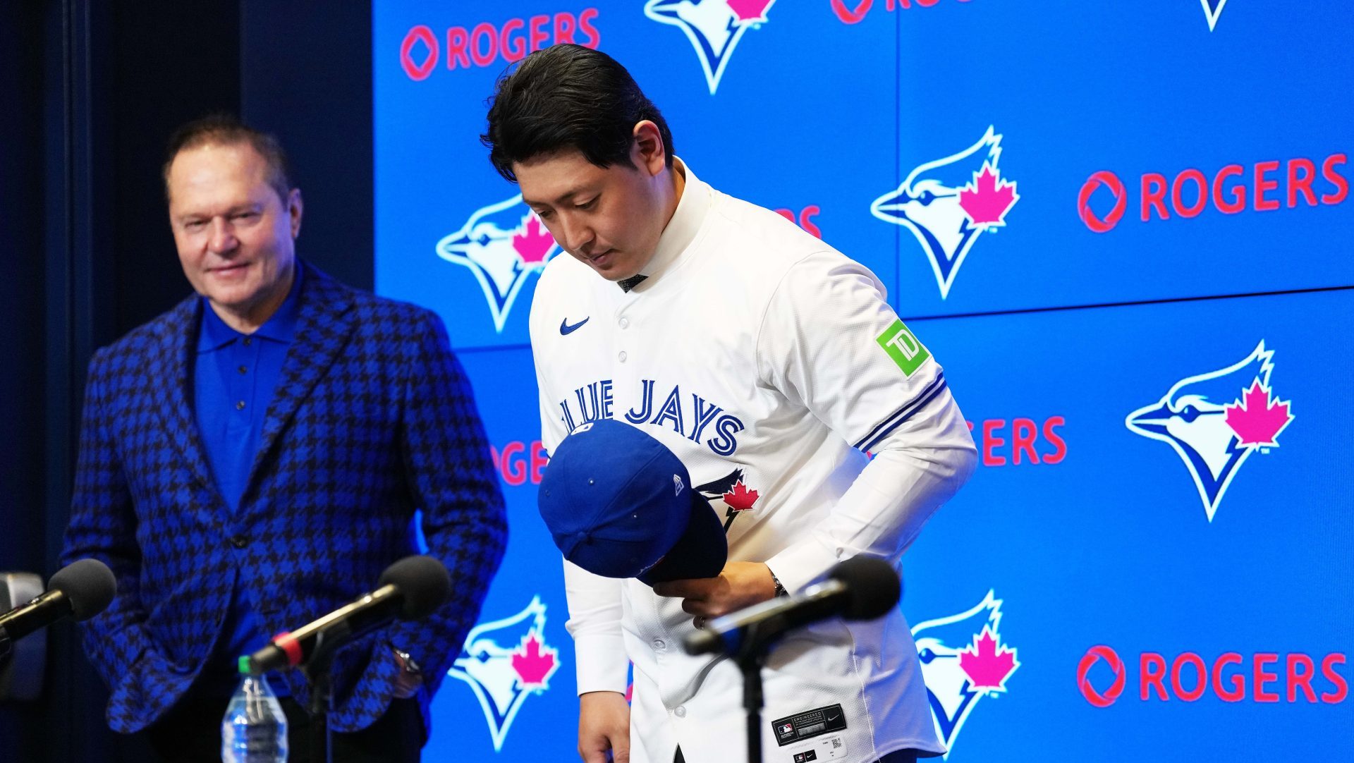 Jan 6, 2026; Toronto, Ontario, Canada; Toronto Blue Jays Kazuma Okamoto bows to the media at the end of the press conference at Rogers Centre.