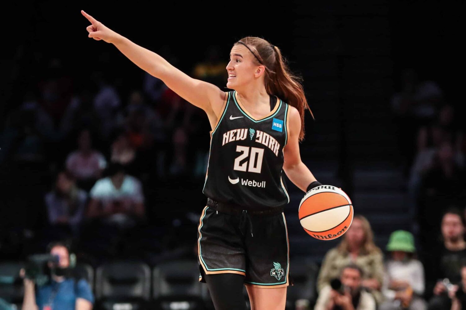 New York Liberty guard Sabrina Ionescu points out a play during a WNBA game.