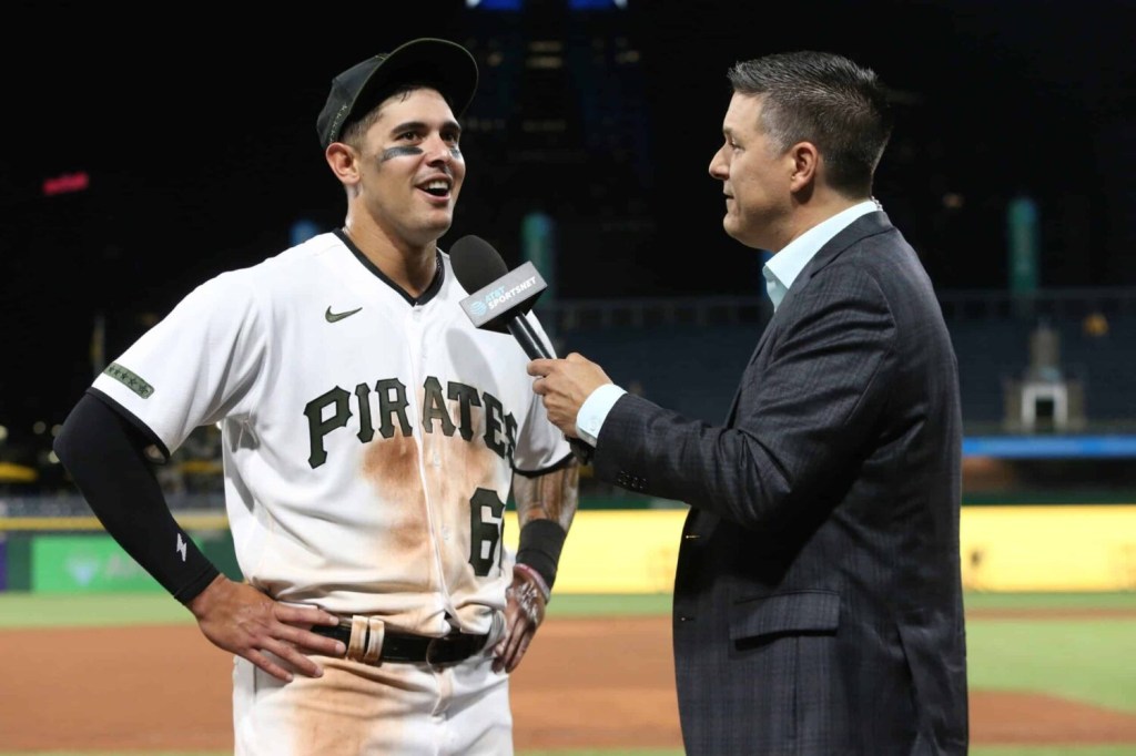 Pittsburgh Pirates right fielder Bligh Madris (66) is interviewed by AT&T Sportsnet reporter Robbie Inmickowski (right) after making his major league debut against the Chicago Cubs at PNC Park. The Pirates won 12-1.