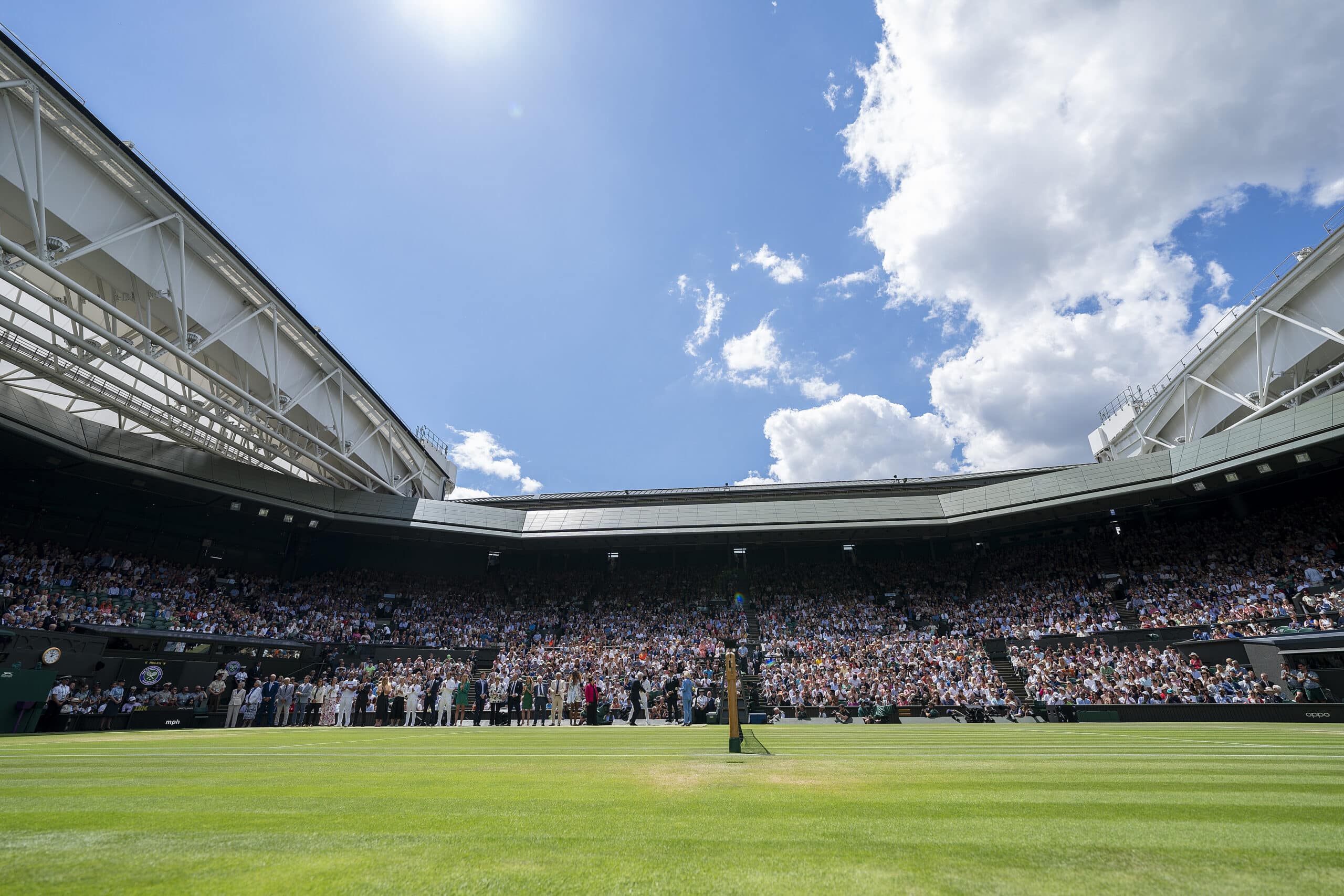 Wimbledon center court on a partly sunny day