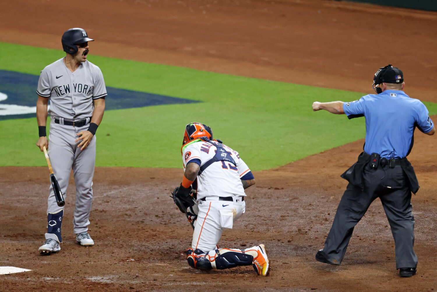 New York Yankees designated hitter Matt Carpenter (24) reacts as home plate umpire Mike Muchlinski (76) signals he struck out against the New York Yankees during the third inning in game one of the ALCS for the 2022 MLB Playoffs at Minute Maid Park.