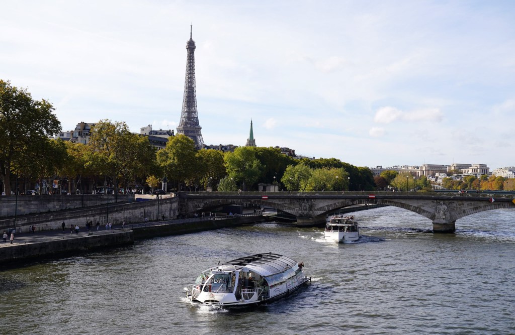 Oct 22, 2022; Paris, FRANCE; General view the Eiffel Tower and the Seine river, as seen from Pont Alexandre III in advance of the Paris 2024 Summer Olympic Games. The bridge will serve as the site for triathlon, open water swim and road cycling.