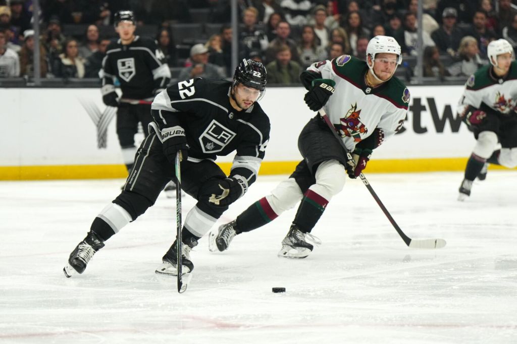 Los Angeles Kings left wing Kevin Fiala skates with the puck against Arizona Coyotes center Barrett Hayton.