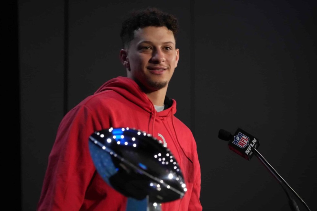 Feb 13, 2023; Phoenix, AZ, USA; Kansas City Chiefs quarterback Patrick Mahomes speaks flanked by Vince Lombardi Trophy during the Super Bowl 57 Winning Team Head Coach and MVP press conference at the Phoenix Convention Center.