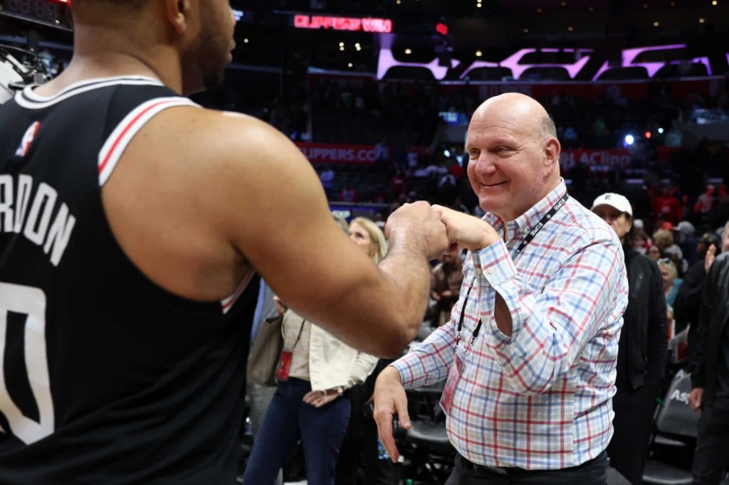 Los Angeles Clippers owner Steve Ballmer celebrates a victory with guard Eric Gordon (10) after defeating the New York Knicks 106-95 at Crypto.com Arena.