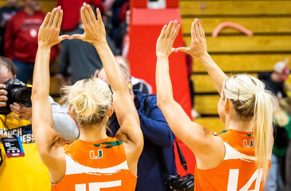 Miami (FL)'s Hanna Cavinder (15) and Haley Cavinder (14) makes the "U" sign after the second half of the NCAA Tournament Second Round game between Indiana and Miami (FL) at Simon Skjodt Assembly Hall on Monday, March 20, 2023.