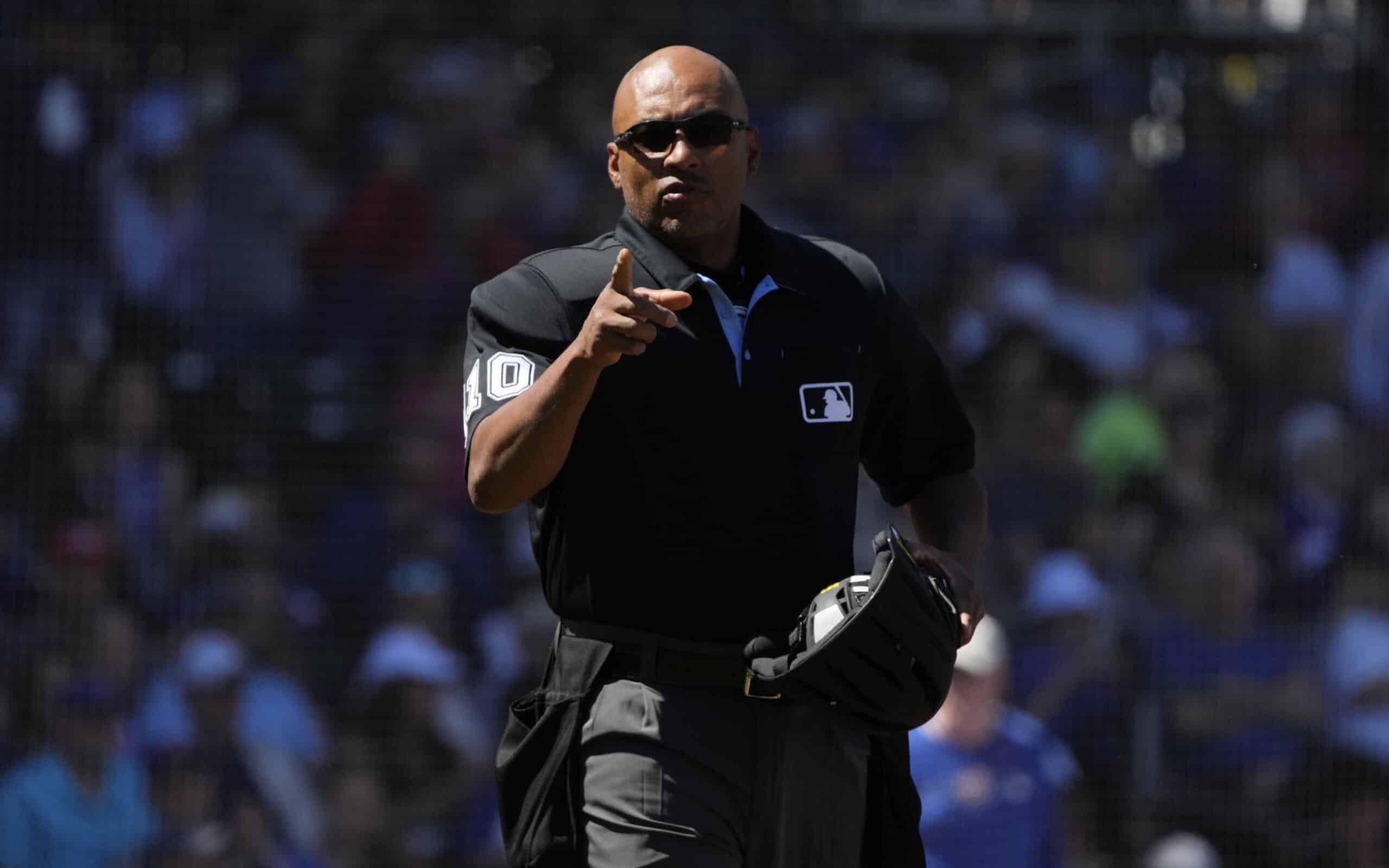 Mar 27, 2023; Mesa, Arizona, USA; MLB umpire Jose Navas points to the Chicago White Sox dugout in the first inning against the Chicago Cubs at Sloan Park.