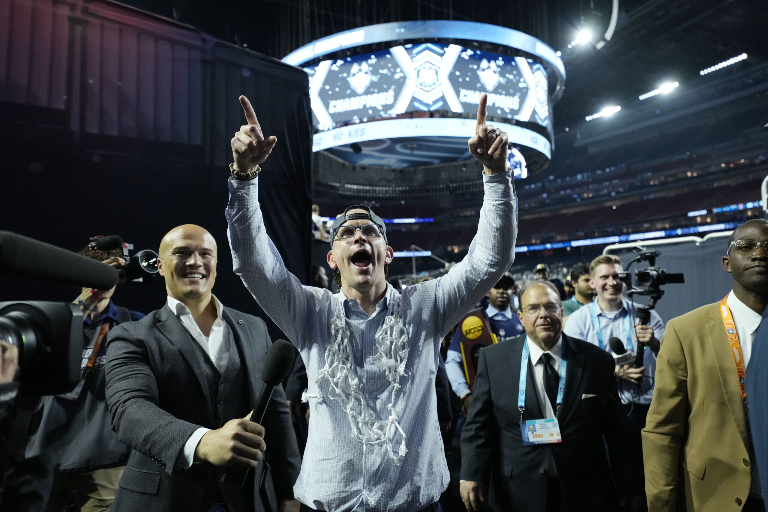Apr 3, 2023; Houston, TX, USA; Connecticut Huskies head coach Dan Hurley celebrates after walking off the court after defeating the San Diego State Aztecs in the national championship game of the 2023 NCAA Tournament at NRG Stadium.